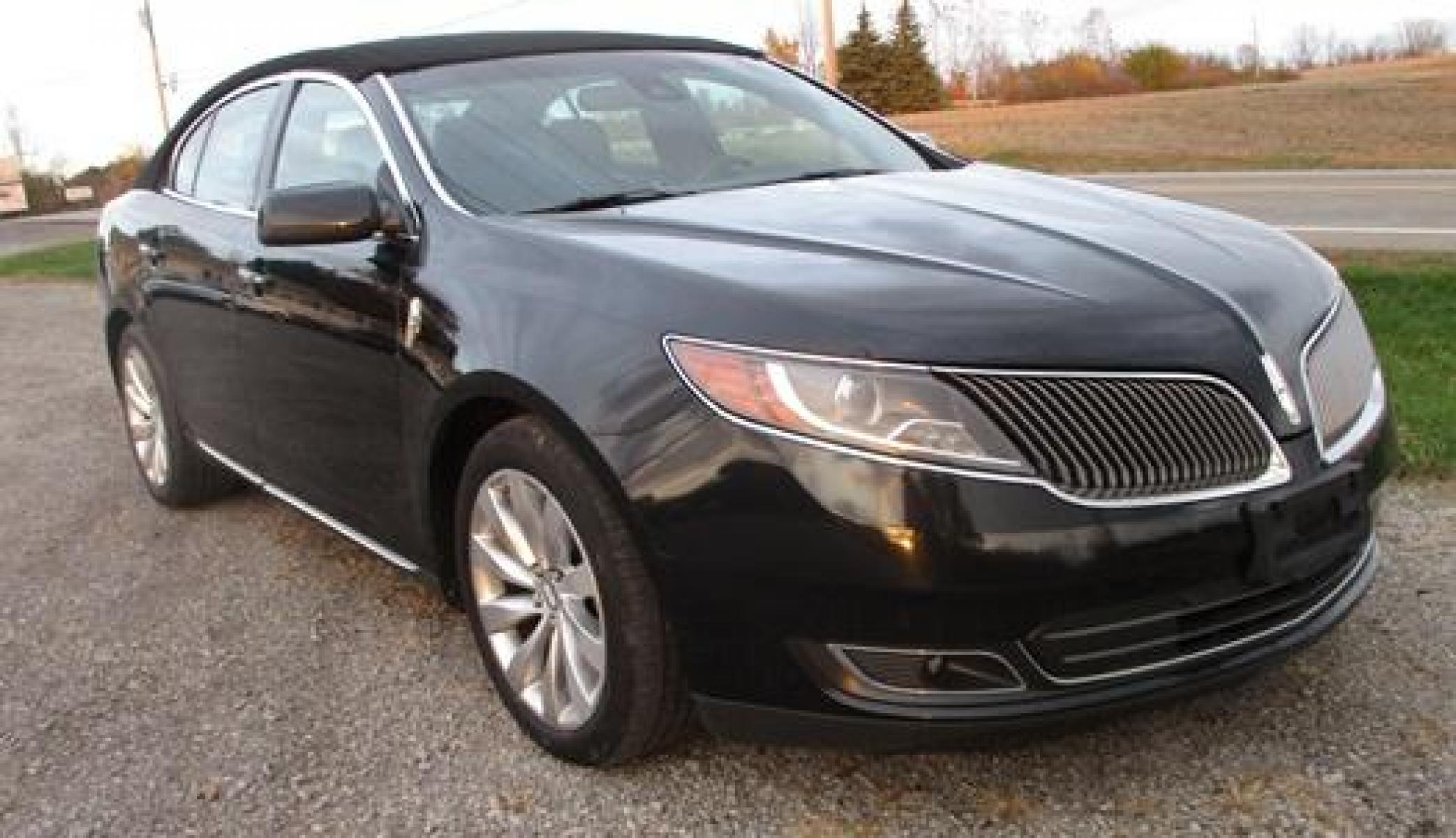 2014 Black /Black Lincoln MKS (1LNHL9EK3EG) with an 3.5L V6 DOHC 24V engine, 6-Speed Automatic transmission, located at 1725 US-68 N, Bellefontaine, OH, 43311, (937) 592-5466, 40.387783, -83.752388 - Presented in stunning Tuxedo Black, our 2014 Lincoln MKS "TUXEDO EDITION" AWD offers a superb blend of refined style and performance. Under the hood is a 3.7 Liter V6 that generates a healthy 305hp. This power is managed by a smooth shifting 6 Speed Automatic transmission that rewards you with impre - Photo #3
