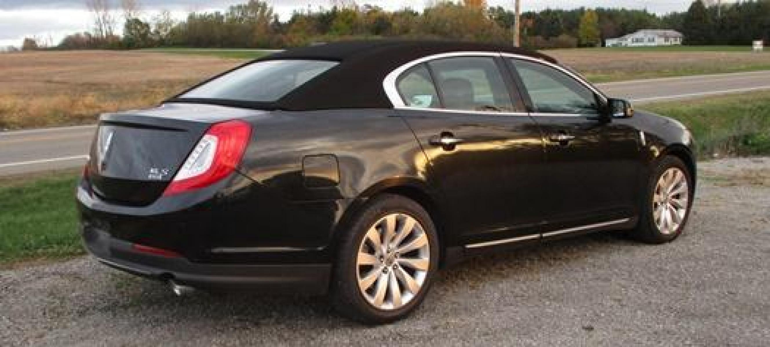 2014 Black /Black Lincoln MKS (1LNHL9EK3EG) with an 3.5L V6 DOHC 24V engine, 6-Speed Automatic transmission, located at 1725 US-68 N, Bellefontaine, OH, 43311, (937) 592-5466, 40.387783, -83.752388 - Presented in stunning Tuxedo Black, our 2014 Lincoln MKS "TUXEDO EDITION" AWD offers a superb blend of refined style and performance. Under the hood is a 3.7 Liter V6 that generates a healthy 305hp. This power is managed by a smooth shifting 6 Speed Automatic transmission that rewards you with impre - Photo #4