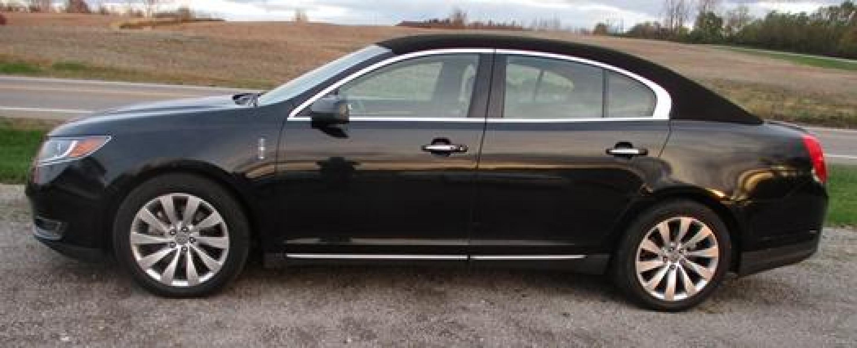 2014 Black /Black Lincoln MKS (1LNHL9EK3EG) with an 3.5L V6 DOHC 24V engine, 6-Speed Automatic transmission, located at 1725 US-68 N, Bellefontaine, OH, 43311, (937) 592-5466, 40.387783, -83.752388 - Presented in stunning Tuxedo Black, our 2014 Lincoln MKS "TUXEDO EDITION" AWD offers a superb blend of refined style and performance. Under the hood is a 3.7 Liter V6 that generates a healthy 305hp. This power is managed by a smooth shifting 6 Speed Automatic transmission that rewards you with impre - Photo #6
