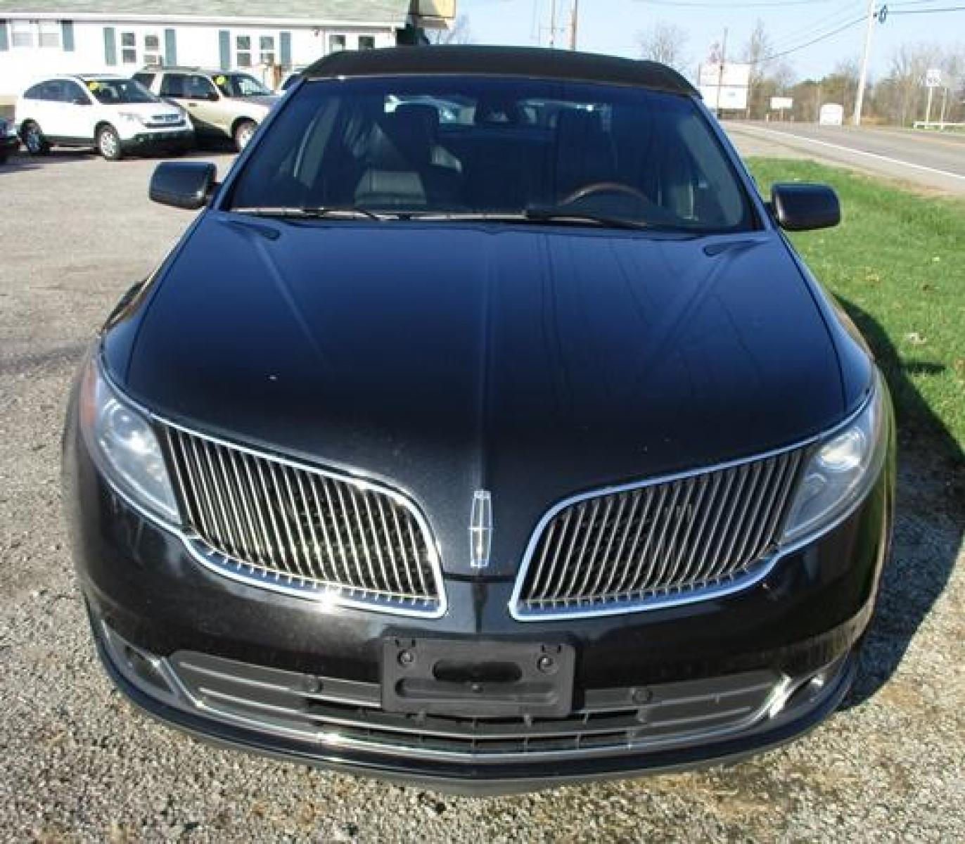 2014 Black /Black Lincoln MKS (1LNHL9EK7EG) with an 3.5L V6 DOHC 24V engine, 6-Speed Automatic transmission, located at 1725 US-68 N, Bellefontaine, OH, 43311, (937) 592-5466, 40.387783, -83.752388 - Photo #7