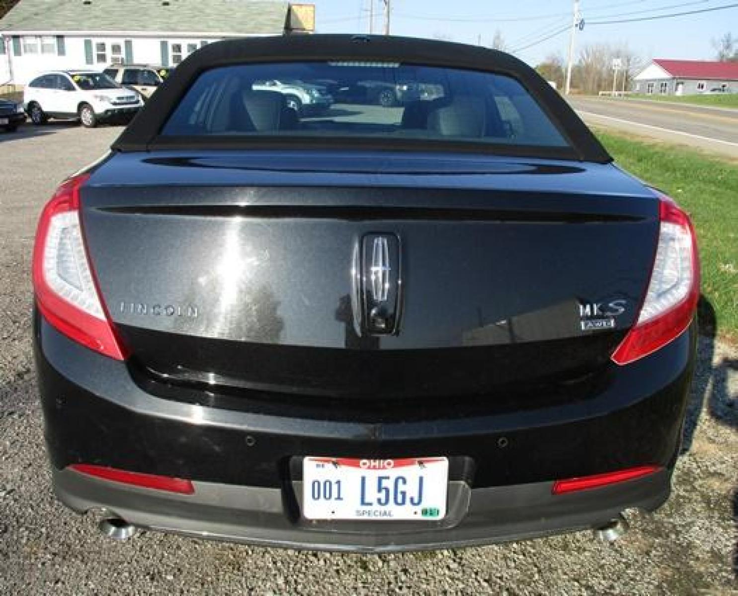 2014 Black /Black Lincoln MKS (1LNHL9EK7EG) with an 3.5L V6 DOHC 24V engine, 6-Speed Automatic transmission, located at 1725 US-68 N, Bellefontaine, OH, 43311, (937) 592-5466, 40.387783, -83.752388 - Photo #8