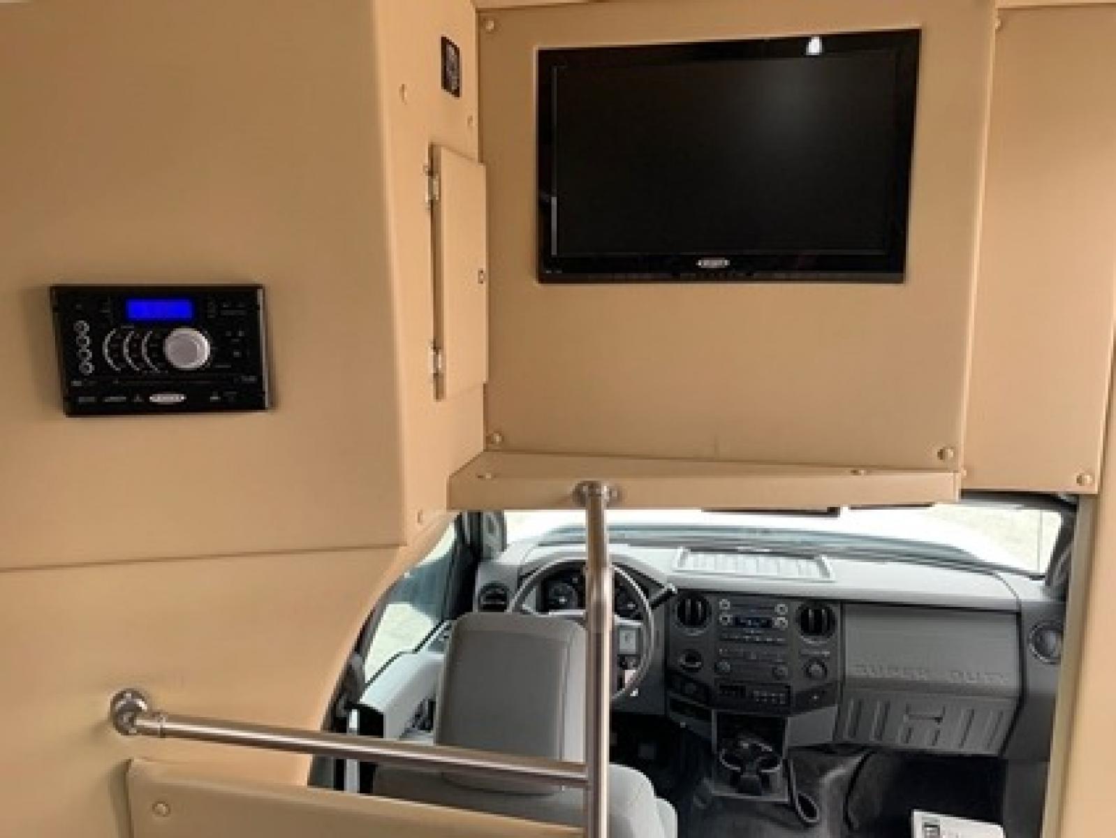 2014 White Ford F550 with an 6.7L engine, Auto transmission, 0.000000, 0.000000 - 2014 Ford F-550, Turtle Top Odyssey XL,- 6.7L Diesel Engine,- Automatic Trans,- Electric Entrance,Door,- 25 Passengers & Driver,- Mid Back Reclining Seats,- Retractable Seat Belts, - 110V Outlets,- Rear Dedicated Luggage,- Stainless Wheel Simulators,- Front and Rear A/C. - Photo #5