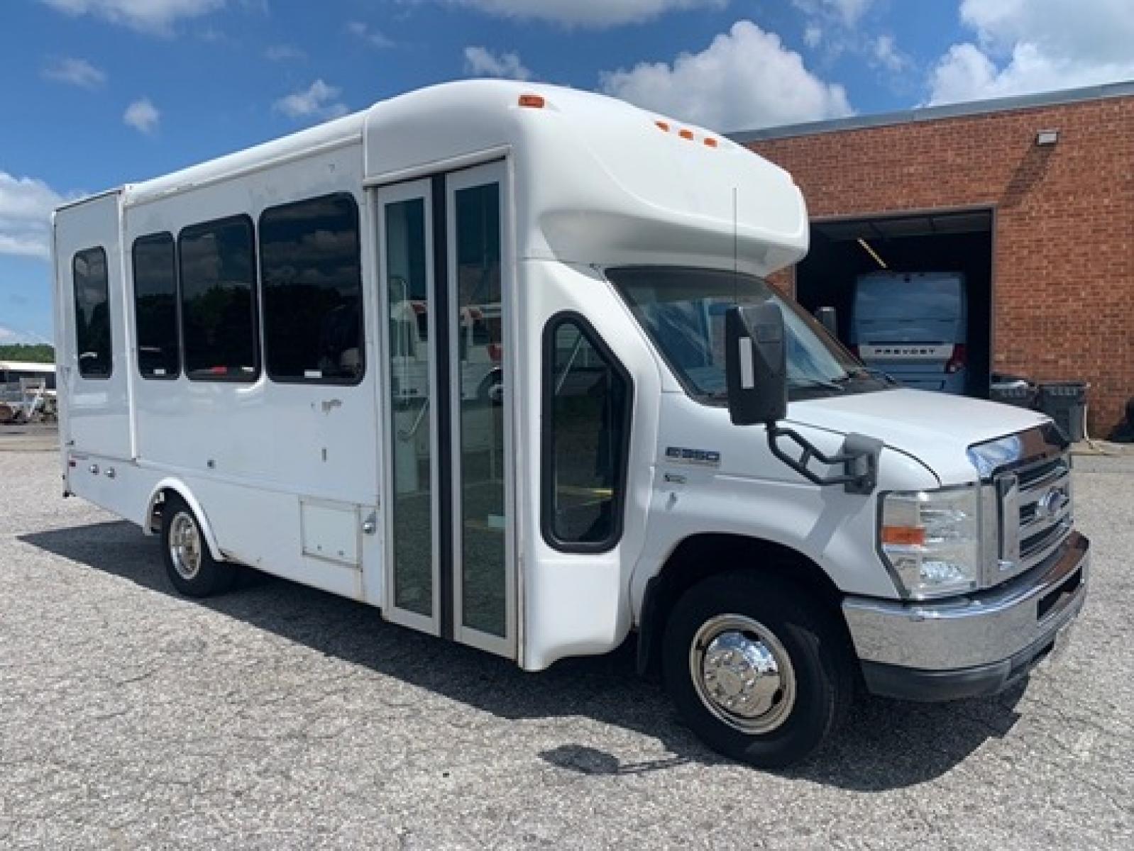 2012 White /Blue Ford E350 with an 5.4L engine, Auto transmission, 0.000000, 0.000000 - 2012 Ford E-350 Starcraft Conversion - 5.4L V8 Gas Engine - Automatic Trans - Electric Entrance Door - 8 Passengers + 2 Wheelchairs - Mid Back Seats - Retractable Seat Belts - Stainless Wheel Simulators - Front and Rear A/C - Handicap Lift - 6 New Tire s - Photo #0