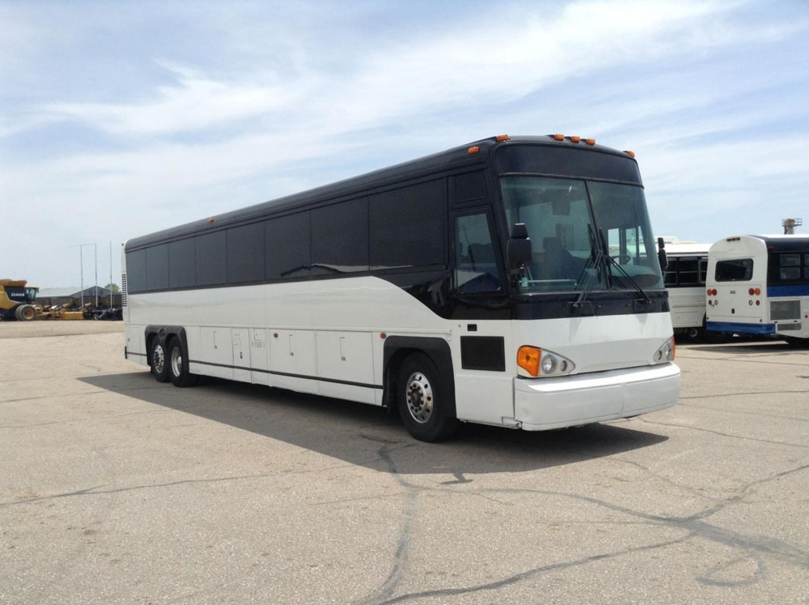 2000 White MCI 102-DL3 with an Detroit Diesel Series 60 engine, Allison transmission, 0.000000, 0.000000 - 2000 MCI 102-DL3 - Series 60 Diesel Engine - Allison Auto Trans. - 45' - 55 Passengers - Flat Screens and DVD - Aluminum Wheels - Enclosed parcel racks – Restroom - New Paint - New Interior - Photo #0