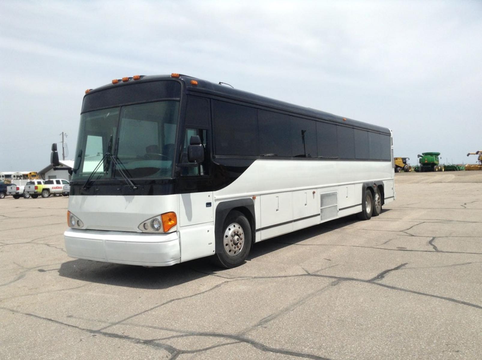 2000 White MCI 102-DL3 with an Detroit Diesel Series 60 engine, Allison transmission, 0.000000, 0.000000 - 2000 MCI 102-DL3 - Series 60 Diesel Engine - Allison Auto Trans. - 45' - 55 Passengers - Flat Screens and DVD - Aluminum Wheels - Enclosed parcel racks – Restroom - New Paint - New Interior - Photo #1