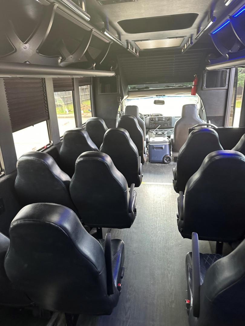 2017 Black /Black Ford E450 with an Gas engine, Auto transmission, 0.000000, 0.000000 - 2017 FORD E450 TIFFANY COACHWORKS EXECUTIVE SHUTTLE 194,000 MILES BLACK EXECUTIVE SEATS AISLE ARMREST LAP BELTS RECLINER SEATS WOOD LOOK FLOORING WINDOW SHADES OVERHEAD RACKS REAR LUGGAGE 23 REAR PASS PLUS DRIVER AND COPLIT (25) TOTAL V-10 GAS AND MUCH MORE! LOCATED IN TEXAS - Photo#5