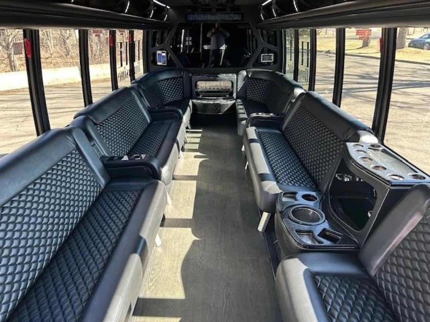 2016 White /Black Ford F550 with an Diesel engine, Auto transmission, 0.000000, 0.000000 - WELL MAINTAINED - ONE OWNER 2016 GRECH F550 GM33 MILEAGE - 151475 DIESEL WHITE / BLACK NEW DIAMOND STITCHED SEATS NEW TURBO NEW DEF NEW WATER PUMP NEW EXHAUST NEW FRONT TIRES LIMO STYLE SEATS AND BAR ULTRA RIDE AIR SYSTEM FRAMELESS COACH WINDOWS PREMIUM SOUND SYSTEM WOOD LOOK FLOORING LED INTERIOR L - Photo#5