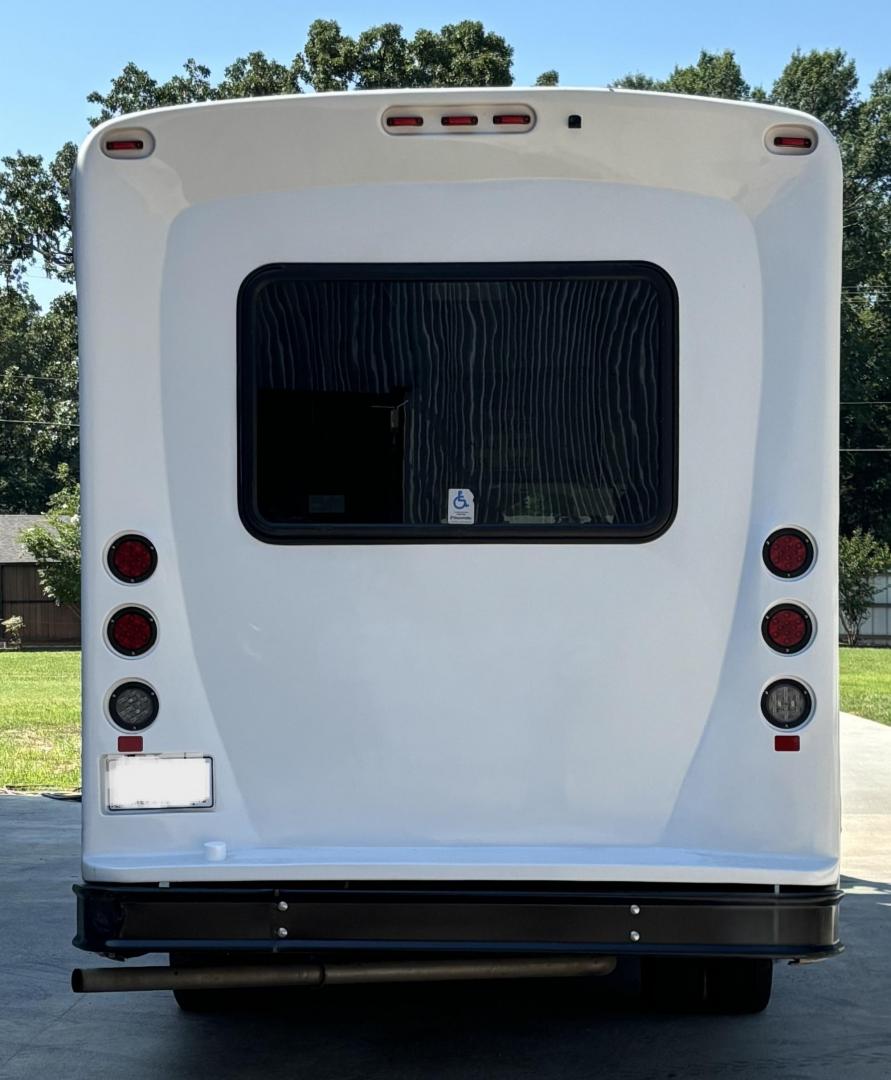 2019 White /Black Ford E350 with an Gas engine, Auto transmission, 0.000000, 0.000000 - 2019 FORD TRANSIT 350 HD WHITE EXTERIOR AWD 156" WB GAS 6 CYL BACK UP CAMERA DASH STEREO / CD 11 PASSENGERS (4) FLIP SEAT WITH UP TO 3 WHEELCHAIR FRONT WHEELCHAIR LIFT GRAY RUBBER FLOORS AND MUCH MORE. APPOX 50K MILES - Photo#2