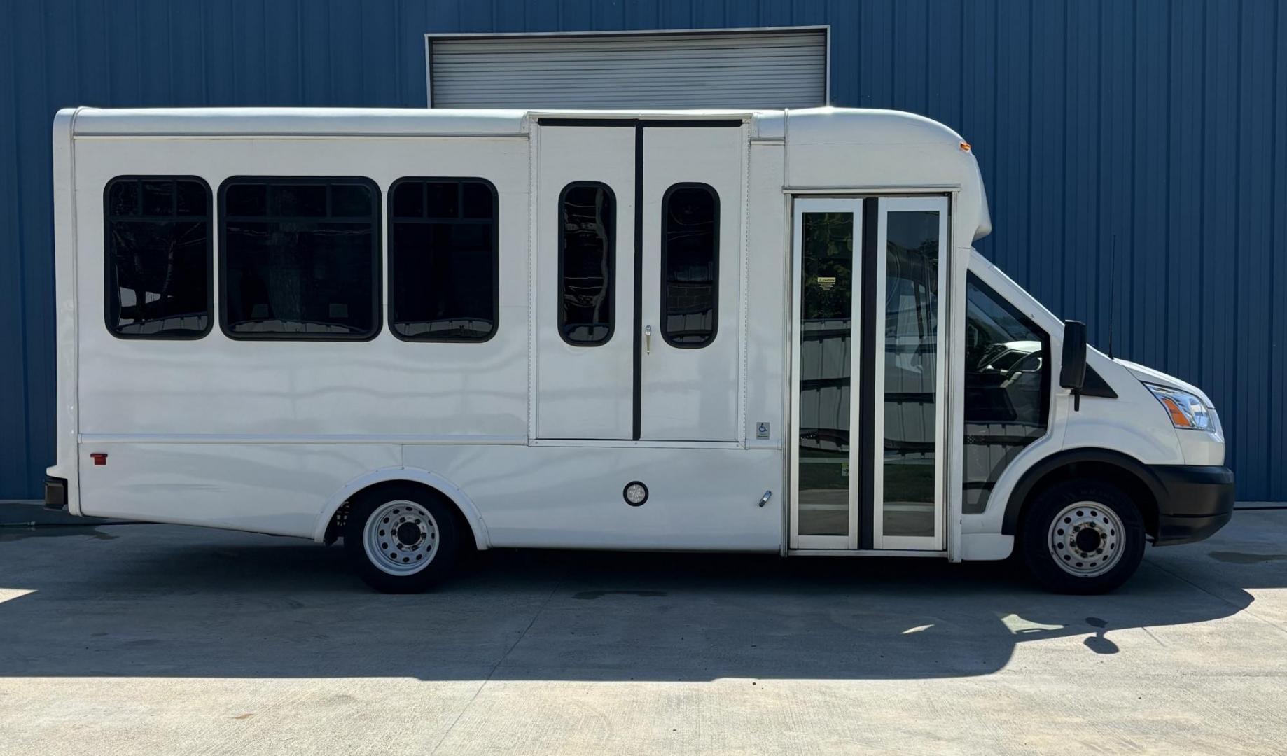 2019 White /Black Ford E350 with an Gas engine, Auto transmission, 0.000000, 0.000000 - 2019 FORD TRANSIT 350 HD WHITE EXTERIOR AWD 156" WB GAS 6 CYL BACK UP CAMERA DASH STEREO / CD 11 PASSENGERS (4) FLIP SEAT WITH UP TO 3 WHEELCHAIR FRONT WHEELCHAIR LIFT GRAY RUBBER FLOORS AND MUCH MORE. APPOX 50K MILES - Photo#1