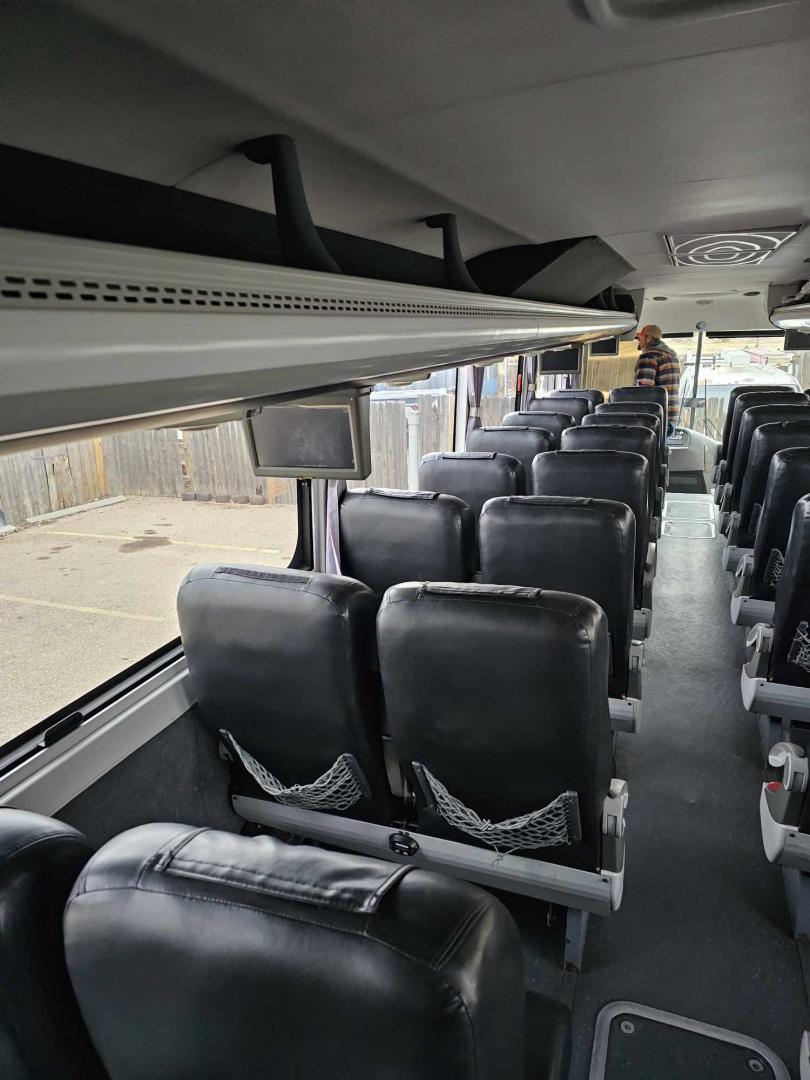 2012 White /Gray/Black CAIO with an Cummins engine, Allison transmission, 0.000000, 0.000000 - 2012 CAIO 38 PASSENGER PLUS 1 CUMMINS ALLISON WHITE EXTERIOR MILEAGE 120,000 (APPROX) RECLINER SEATS SEAT BELTS FOOT RESTS OVERHEAD STORAGE UNDERBELLY STORAGE USB PORTS DUCTED A/C READING LIGHTS TV MONITORS AND MUCH MORE ASKING CALL FOR PICTURES - Photo#5