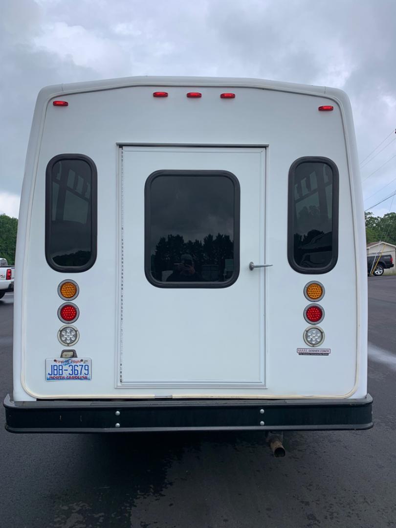 2010 White /Red/Gray Ford E450 with an V10 engine, Auto transmission, 0.000000, 0.000000 - 2010 Ford E-450 – Goshen Coach - 25 Passengers + Driver - 6.8L V10 Engine – Automatic - High Back Reclining Seats – Seat Belts -Electric Entrance Doors – Overhead Storage – Reading Lights – Front/Rear AC – Stainless Wheel Simulators - Photo#12