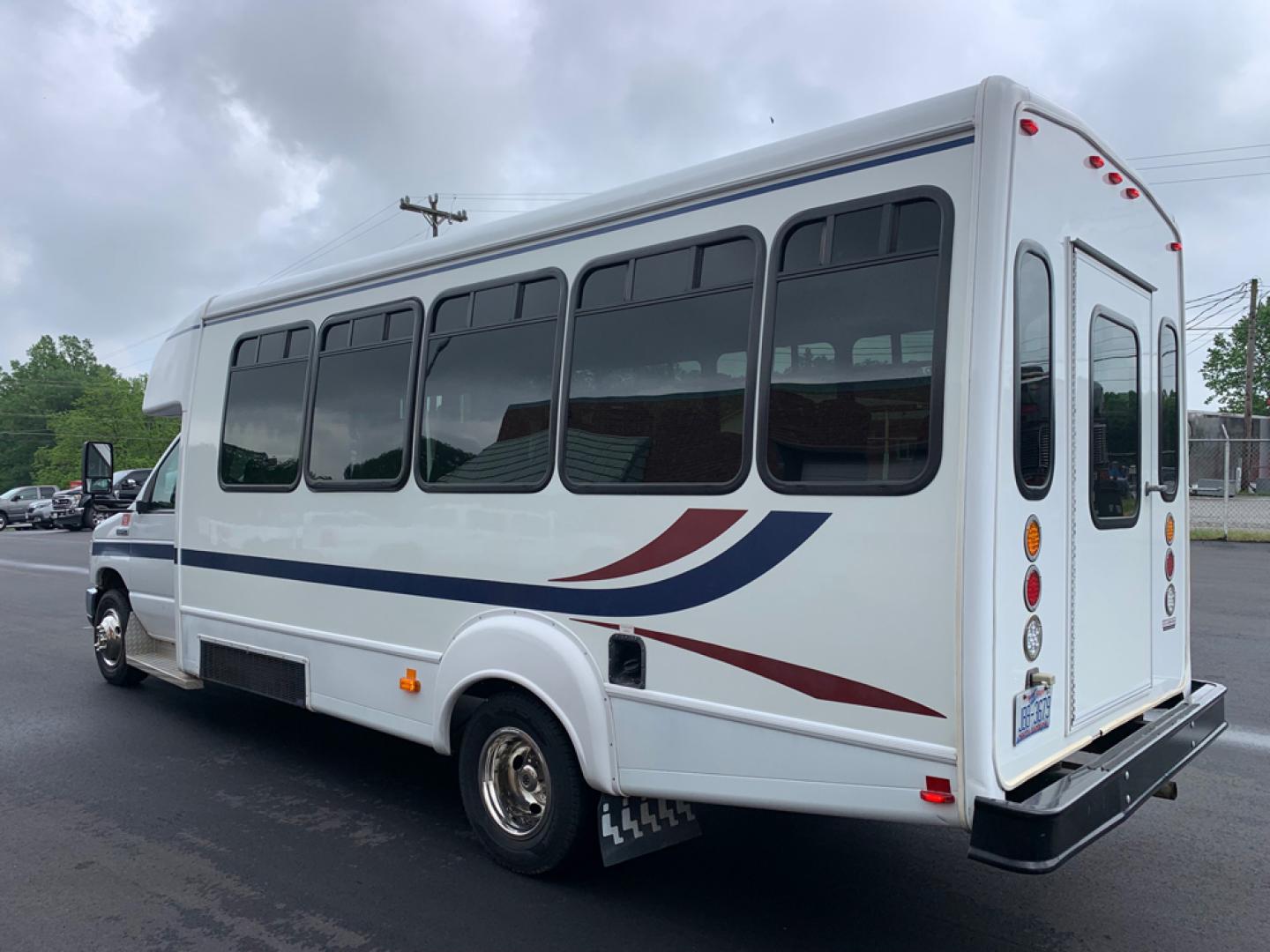 2010 White /Red/Gray Ford E450 with an V10 engine, Auto transmission, 0.000000, 0.000000 - 2010 Ford E-450 – Goshen Coach - 25 Passengers + Driver - 6.8L V10 Engine – Automatic - High Back Reclining Seats – Seat Belts -Electric Entrance Doors – Overhead Storage – Reading Lights – Front/Rear AC – Stainless Wheel Simulators - Photo#3