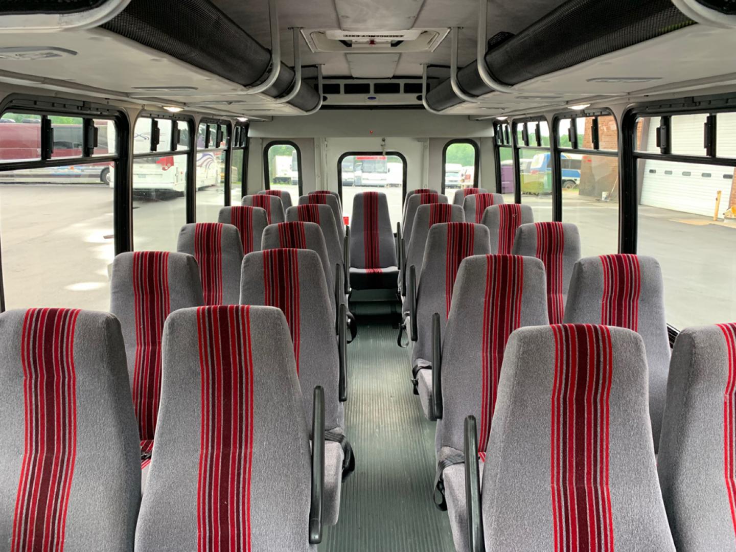 2010 White /Red/Gray Ford E450 with an V10 engine, Auto transmission, 0.000000, 0.000000 - 2010 Ford E-450 – Goshen Coach - 25 Passengers + Driver - 6.8L V10 Engine – Automatic - High Back Reclining Seats – Seat Belts -Electric Entrance Doors – Overhead Storage – Reading Lights – Front/Rear AC – Stainless Wheel Simulators - Photo#7