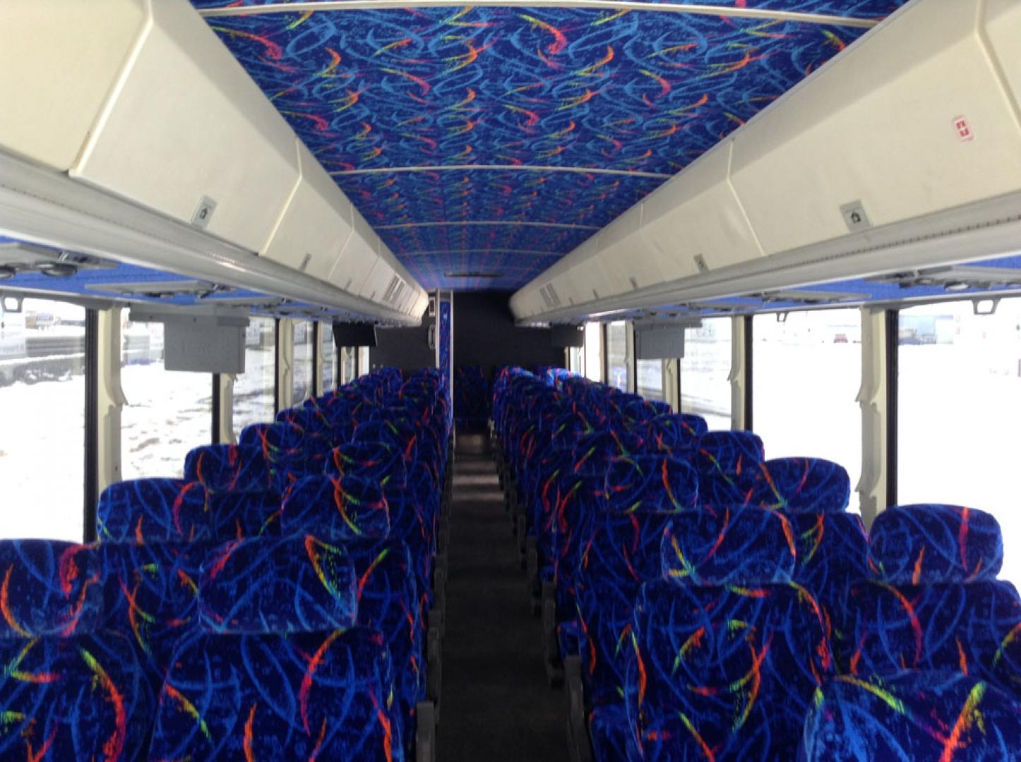 2000 White /Blue MCI 102-DL3 with an Series 60 Detroit Diesel engine, Allison transmission, 0.000000, 0.000000 - 2000 MCI 102-DL3 - Series 60 Diesel Engine - Allison Auto Trans. - 45' - 55 Passengers - Flat Screens and DVD - Aluminum Wheels - Enclosed parcel racks – Restroom - New Paint - New Interior - Photo#4