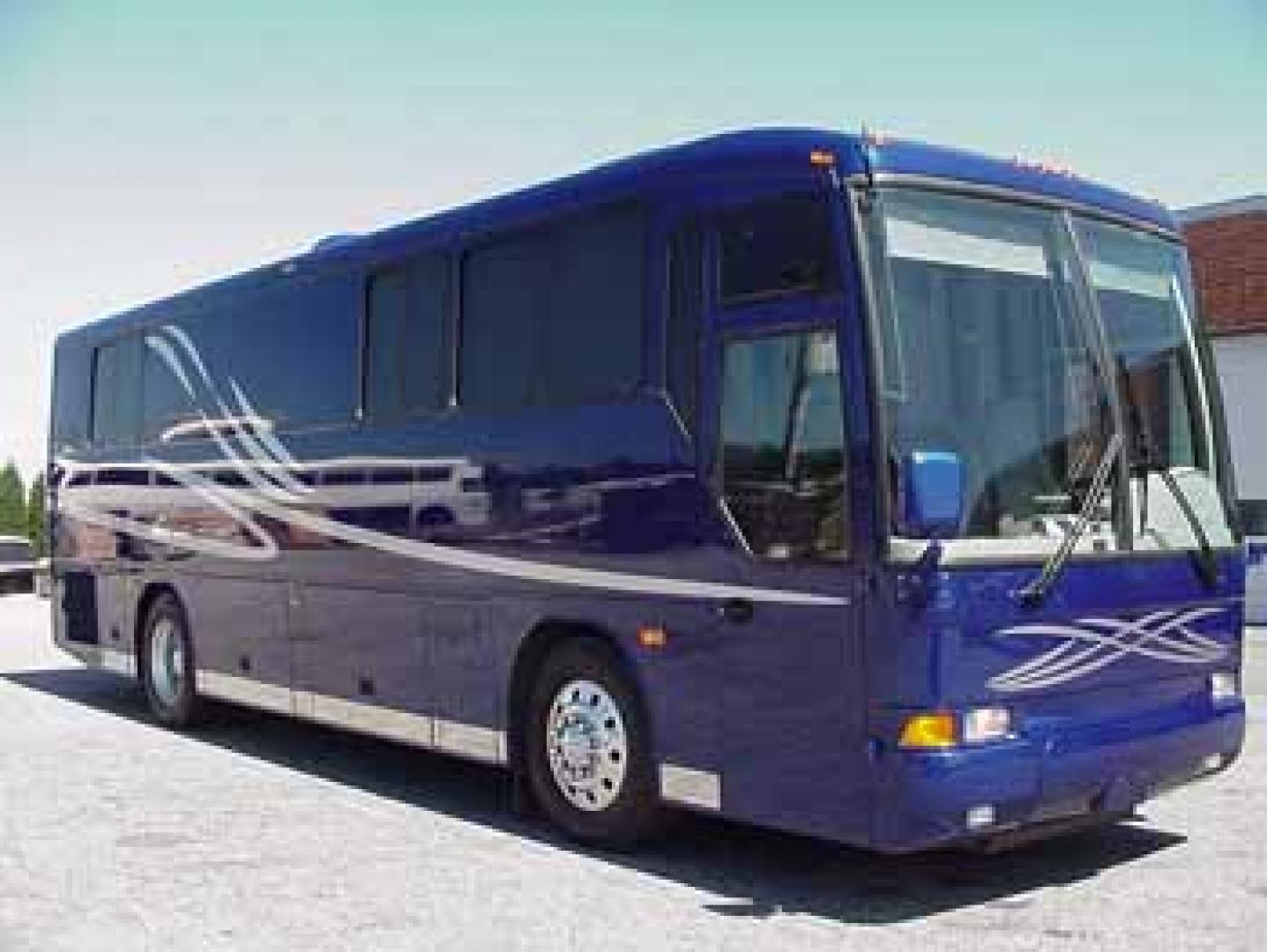 2002 Blue /Red/Gray MCI F3500 with an 300 Cummins engine, Allison transmission, 0.000000, 0.000000 - 2002 MCI F3500 300 Cummins Diesel Engine – Allison Automatic Transmission - 35' Long - Raised Roof - Front Lounge – Kitchen - Restroom with Shower - Rear Bedroom - Slide outs in luggage bays - 12.5 KW Kubota Generator - 3 Roof Heat Pumps - Aluminum wheels - 11,000 Total Coach Miles - Photo#0