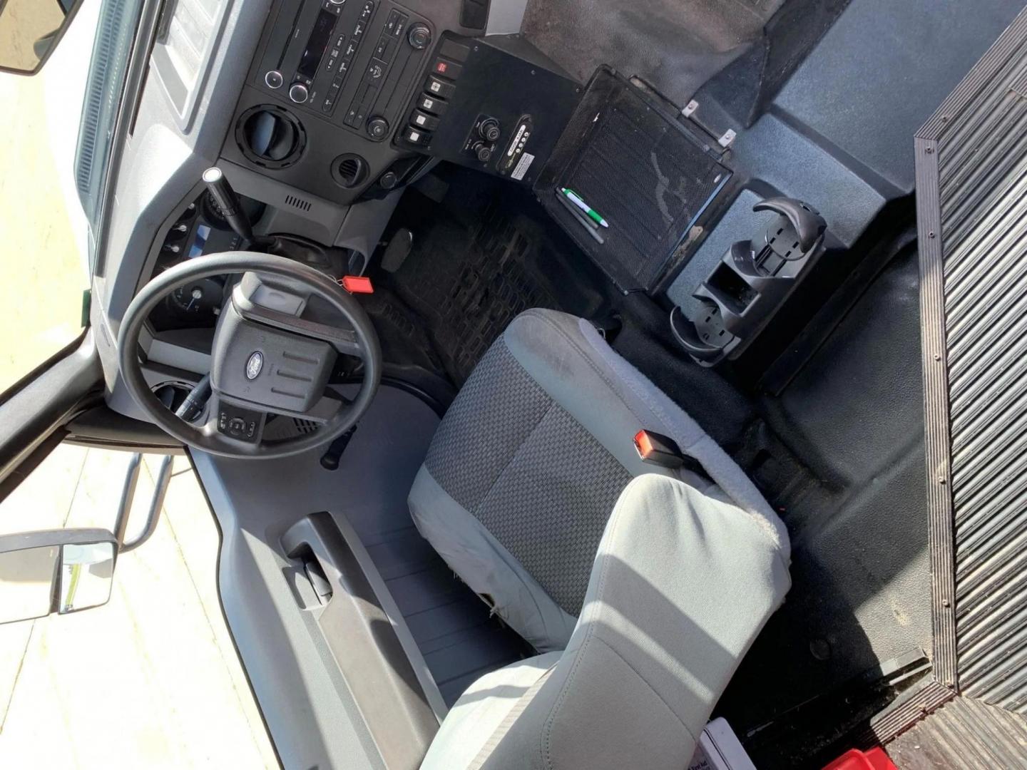 2015 White /Gray Ford F550 with an 6.8L V10 engine, Auto transmission, 0.000000, 0.000000 - 2015 FORD F550 SUPER DUTY GOSHEN COACH 6.8L V10 GAS 24 PASSENGERS PLUS WHEEL CHAIR POSITIONS, AND DRIVER REAR LIFT WITH TWO TIE DOWNS BLACK RUBBER FLOORING REAR HEAT AND A/C BI-FOLD ELECTRIC DOOR AM, FM CD PLAYER RADIO ISLE GRAB HANDLES LAP BELTS GRAY CLOTH SEAT AND MUCH MORE. STILL IN SERVICE LOCAT - Photo#11