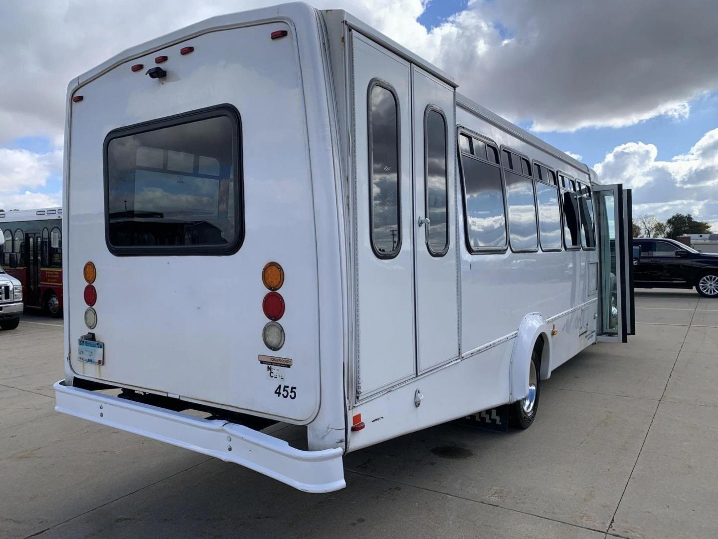 2015 White /Gray Ford F550 with an V10 engine, Auto transmission, 0.000000, 0.000000 - 2015 FORD F550 SUPER DUTY GOSHEN COACH 6.8L V10 GAS 24 PASSENGERS PLUS WHEEL CHAIR POSITIONS, AND DRIVER REAR LIFT WITH TWO TIE DOWNS BLACK RUBBER FLOORING REAR HEAT AND A/C BI-FOLD ELECTRIC DOOR AM, FM CD PLAYER RADIO ISLE GRAB HANDLES LAP BELTS GRAY CLOTH SEAT AND MUCH MORE. STILL IN SERVICE LOCAT - Photo#3
