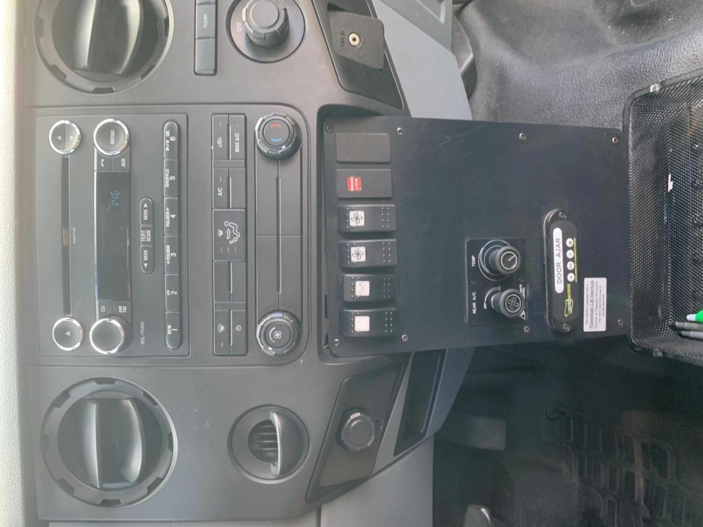 2015 White /Gray Ford F550 with an V10 engine, Auto transmission, 0.000000, 0.000000 - 2015 FORD F550 SUPER DUTY GOSHEN COACH 6.8L V10 GAS 24 PASSENGERS PLUS WHEEL CHAIR POSITIONS, AND DRIVER REAR LIFT WITH TWO TIE DOWNS BLACK RUBBER FLOORING REAR HEAT AND A/C BI-FOLD ELECTRIC DOOR AM, FM CD PLAYER RADIO ISLE GRAB HANDLES LAP BELTS GRAY CLOTH SEAT AND MUCH MORE. STILL IN SERVICE LOCAT - Photo#9