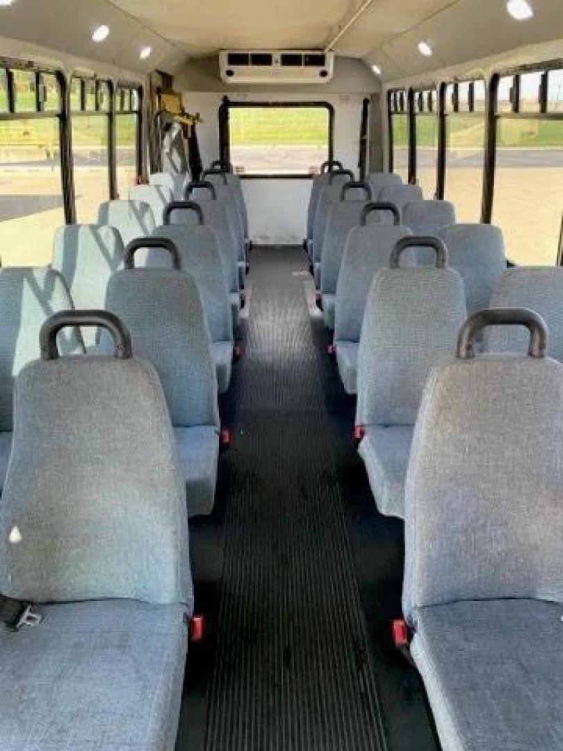 2015 White /Gray Ford F550 with an V10 engine, Auto transmission, 0.000000, 0.000000 - 2015 FORD F550 SUPER DUTY GOSHEN COACH 6.8L V10 GAS 24 PASSENGERS PLUS WHEEL CHAIR POSITIONS, AND DRIVER REAR LIFT WITH TWO TIE DOWNS BLACK RUBBER FLOORING REAR HEAT AND A/C BI-FOLD ELECTRIC DOOR AM, FM CD PLAYER RADIO ISLE GRAB HANDLES LAP BELTS GRAY CLOTH SEAT AND MUCH MORE. STILL IN SERVICE LOCAT - Photo#7