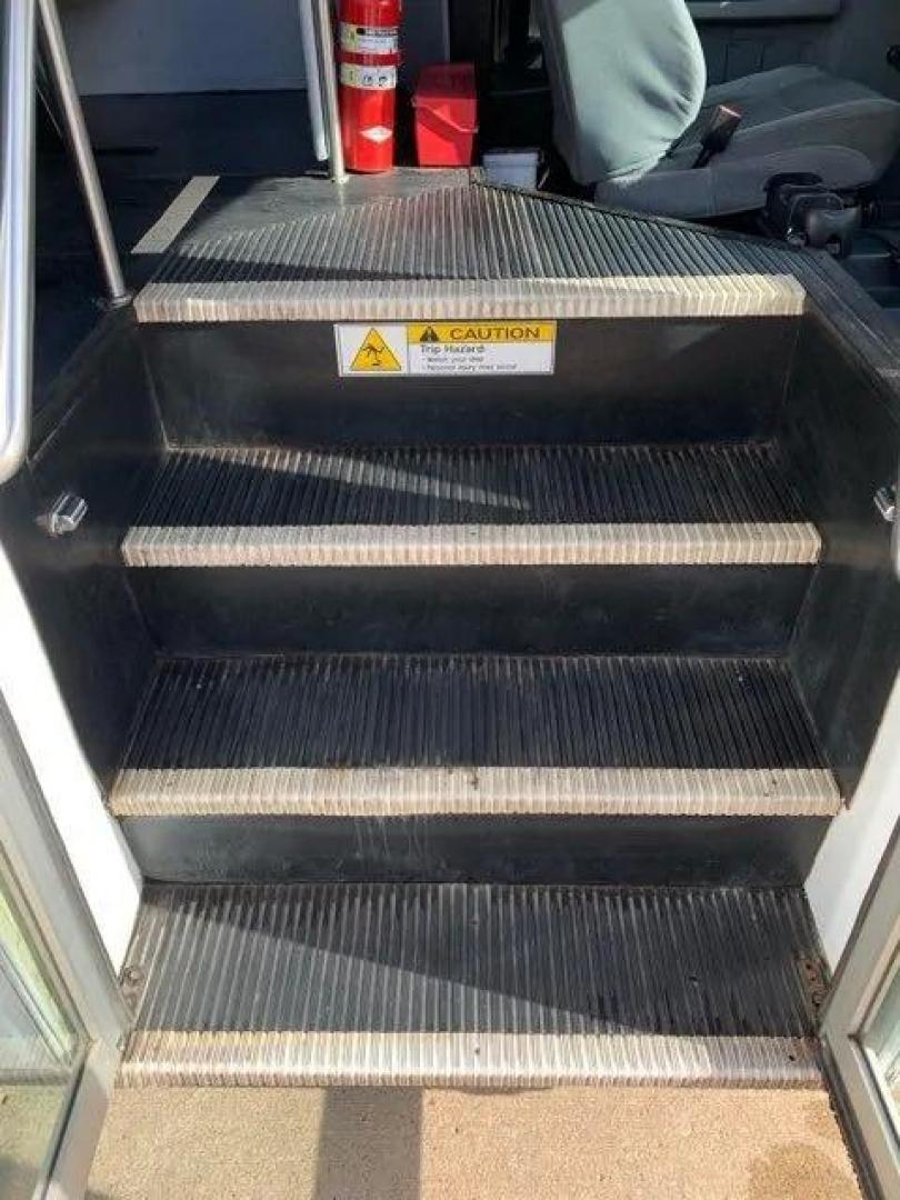 2015 White /Gray Ford F550 with an V10 engine, Auto transmission, 0.000000, 0.000000 - 2015 FORD F550 SUPER DUTY GOSHEN COACH 6.8L V10 GAS 24 PASSENGERS PLUS WHEEL CHAIR POSITIONS, AND DRIVER REAR LIFT WITH TWO TIE DOWNS BLACK RUBBER FLOORING REAR HEAT AND A/C BI-FOLD ELECTRIC DOOR AM, FM CD PLAYER RADIO ISLE GRAB HANDLES LAP BELTS GRAY CLOTH SEAT AND MUCH MORE. STILL IN SERVICE LOCAT - Photo#12