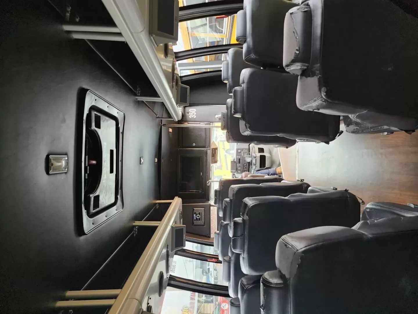 2013 /Black Ford E450 with an V10 engine, Auto transmission, 0.000000, 0.000000 - 2013 FORD E450 V-10 GAS TURTLE TOP BLACK EXTERIOR 24 PASS EXECUTIVE SHUTTLE BLACK EXECUTIVE SEATS - (SEAT COVER NEED REPLACED) LAP BELTS RECLINER SEATS WOOD LOOK FLOORING OVERHEAD RACKS REAR LUGGAGE AIR RIDE NEW TRANSMISSION AND MUCH MORE! LOCATED IN NEWBURGEH, NY FINANCING AVAILABLE WITH APPROVED C - Photo#5