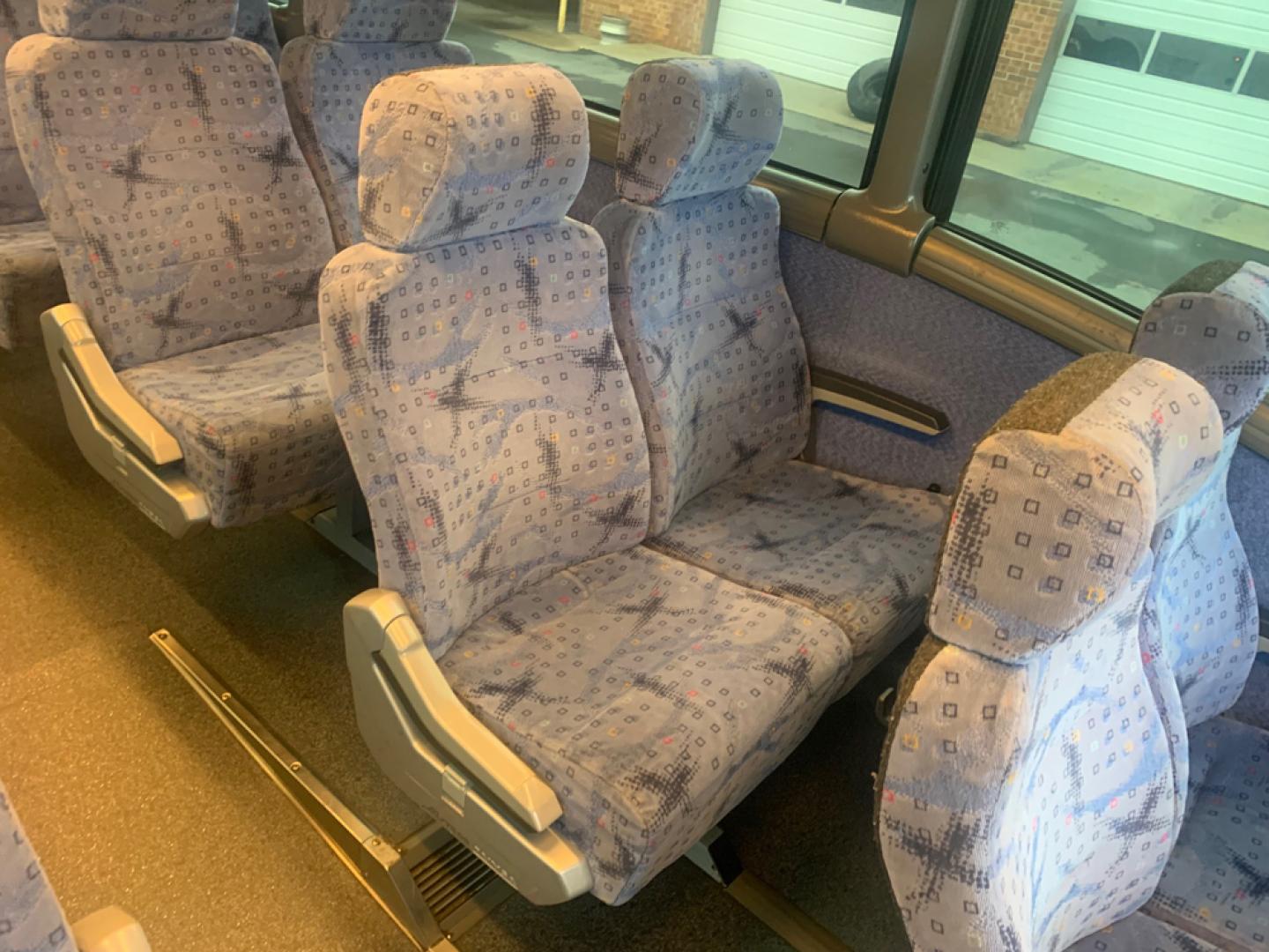 2007 White /Gray MCI J4500 with an Cat Diesel engine, ZF AUTO transmission, located at 1725 US-68 N, Bellefontaine, OH, 43311, (937) 592-5466, 40.387783, -83.752388 - 2007 MCI J4500 - Cat Diesel Engine - ZF Auto Trans. - 45' - 56 Passengers - Seat Belts - 6 Flat Screens and DVD - Enclosed parcel racks – Restroom - Aluminum Wheels - Photo#11