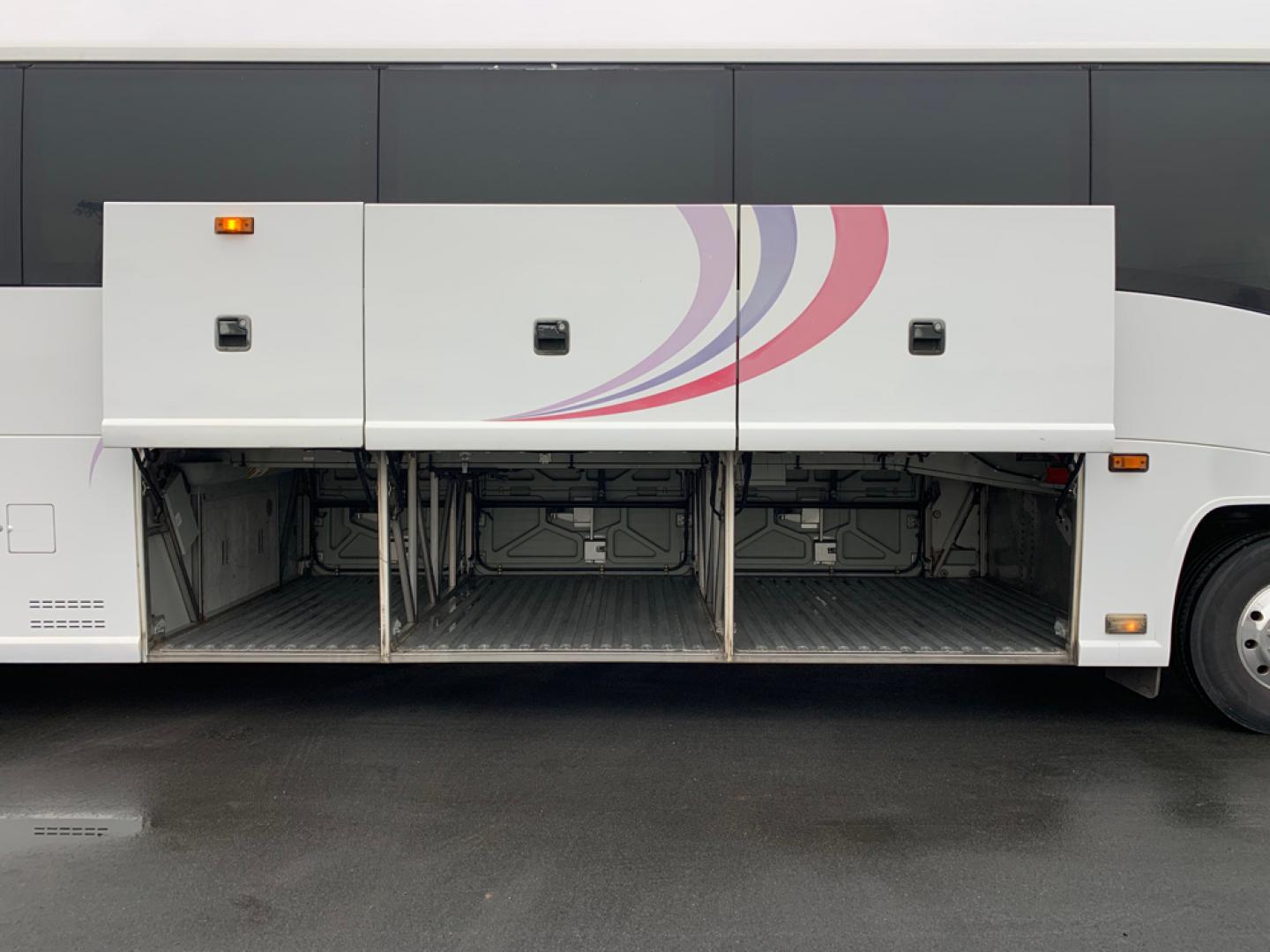 2007 White /Gray MCI J4500 with an Cat Diesel engine, ZF AUTO transmission, located at 1725 US-68 N, Bellefontaine, OH, 43311, (937) 592-5466, 40.387783, -83.752388 - 2007 MCI J4500 - Cat Diesel Engine - ZF Auto Trans. - 45' - 56 Passengers - Seat Belts - 6 Flat Screens and DVD - Enclosed parcel racks – Restroom - Aluminum Wheels - Photo#14