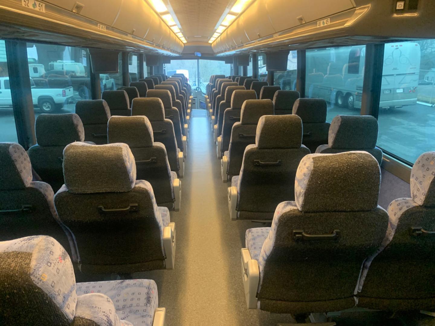 2007 White /Gray MCI J4500 with an Cat Diesel engine, ZF AUTO transmission, located at 1725 US-68 N, Bellefontaine, OH, 43311, (937) 592-5466, 40.387783, -83.752388 - 2007 MCI J4500 - Cat Diesel Engine - ZF Auto Trans. - 45' - 56 Passengers - Seat Belts - 6 Flat Screens and DVD - Enclosed parcel racks – Restroom - Aluminum Wheels - Photo#12