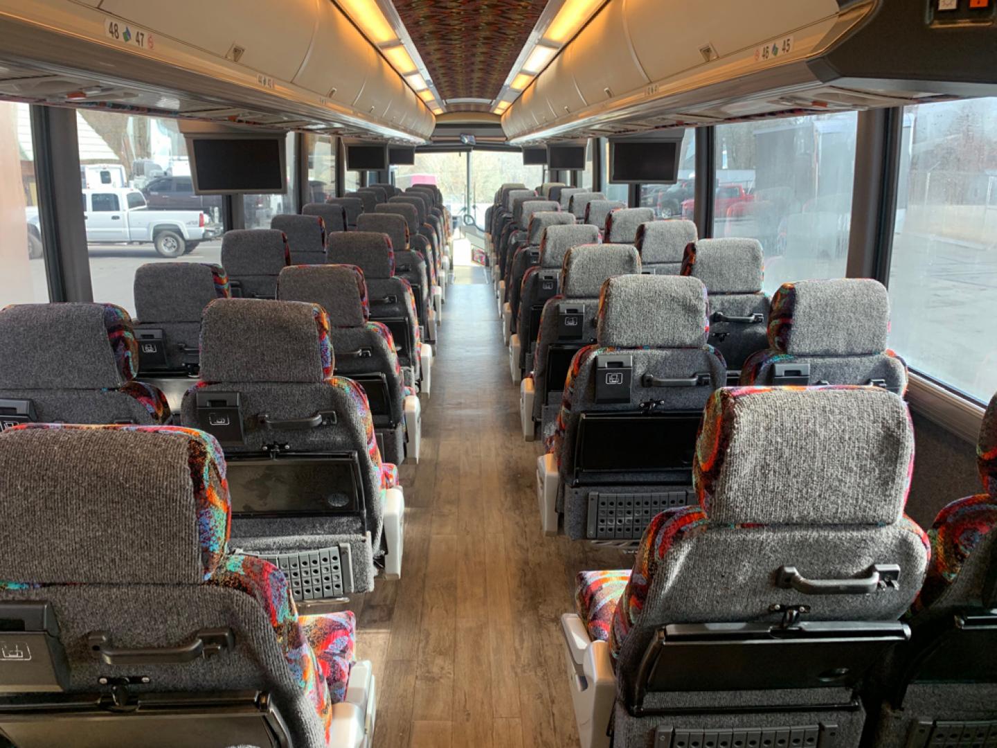 1999 White /Gray/ Red/Blue MCI EL3 with an Series 60 Detroit Diesel engine, Allison transmission, located at 1725 US-68 N, Bellefontaine, OH, 43311, (937) 592-5466, 40.387783, -83.752388 - Series 60 Diesel Engine - Allison Auto Trans. - 45' - 54 Passengers - 6 Flat Screens and DVD - Enclosed parcel racks – Restroom - 110V Outlets - Aluminum Wheels - Two Owner Coach - - Photo#13