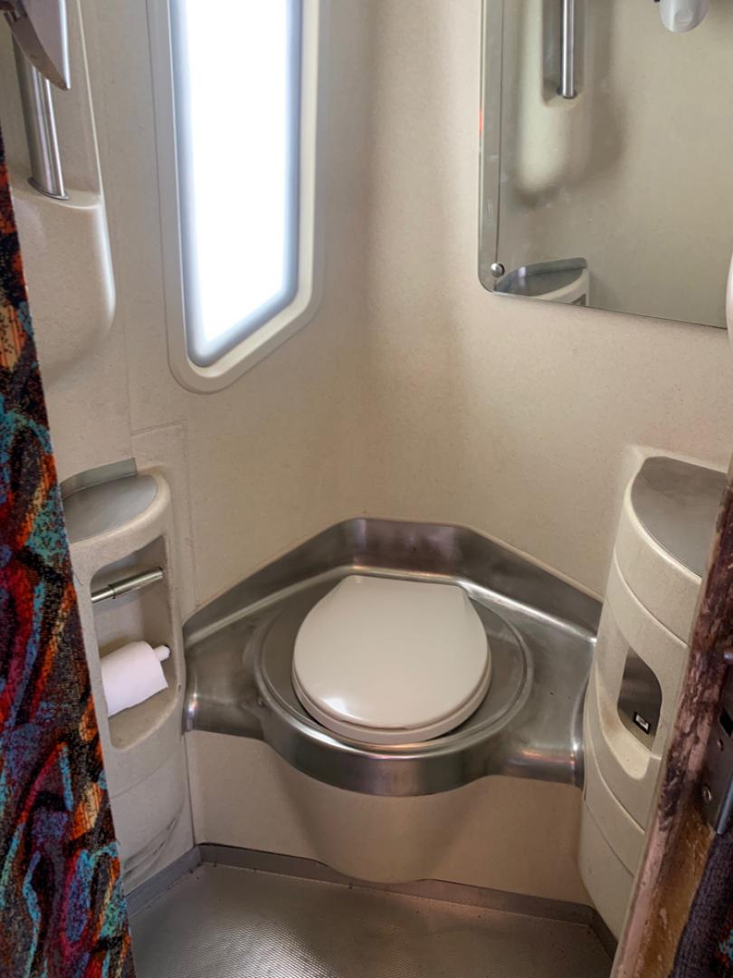 1999 White /Gray/ Red/Blue MCI EL3 with an Series 60 Detroit Diesel engine, Allison transmission, located at 1725 US-68 N, Bellefontaine, OH, 43311, (937) 592-5466, 40.387783, -83.752388 - Series 60 Diesel Engine - Allison Auto Trans. - 45' - 54 Passengers - 6 Flat Screens and DVD - Enclosed parcel racks – Restroom - 110V Outlets - Aluminum Wheels - Two Owner Coach - - Photo#14