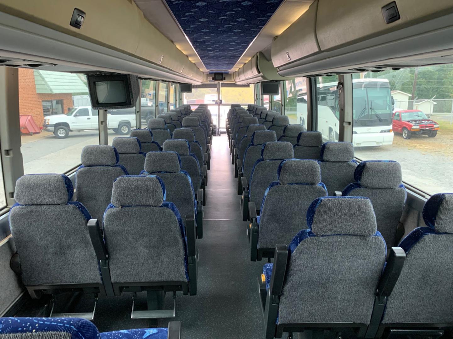 1999 White / Blue Prevost HS-45 with an Series 60 Detroit Diesel engine, Allison transmission, 0.000000, 0.000000 - 1999 PREVOST H3-45 - Series 60 Detroit Diesel - Allison Automatic Transmission - 45' - 56 Passengers - - 4 Monitors and DVD - Handicap Lift - Enclosed Parcel Racks - 110V Plugs - Updated Interior - Wheel Simulators - Photo#12