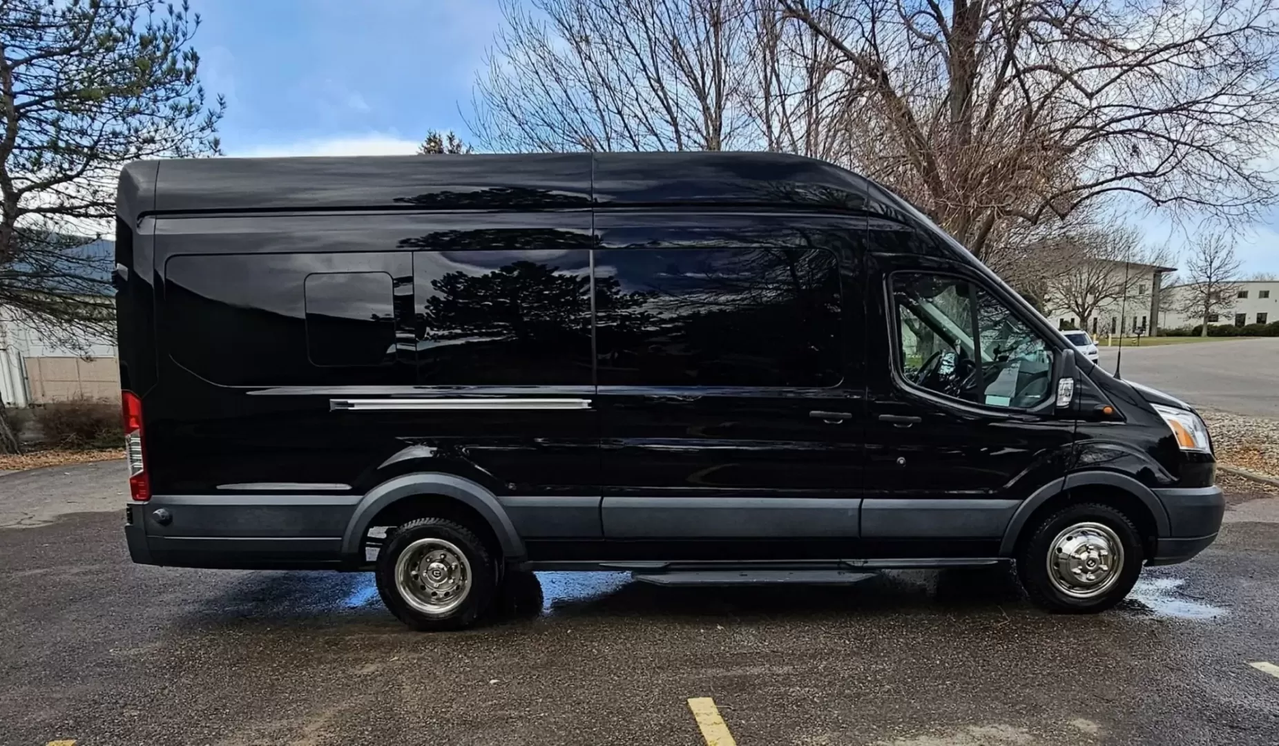 2017 Black /Black Ford Transit with an Gas engine, Auto transmission, 0.000000, 0.000000 - 2017 FORD TRANSIT 3.7L GAS ENGINE BUILT BY PINNICALE INTERIOR BLACK DIAMOND PATTERN LIMO BENCH SEATS 10 PASSENGERS PLUS DRIVER AND COPILOT - RACK LIMO BENCH SEATING POWER PARTITION TV'S FRONT AND REAR COVED RGB LIGHTING ON SIDE WALLS OVER HEAD DOME LIGHTS GRAY WOOD LOOK FLOORING MAYBACH CEILING LIGH - Photo#0