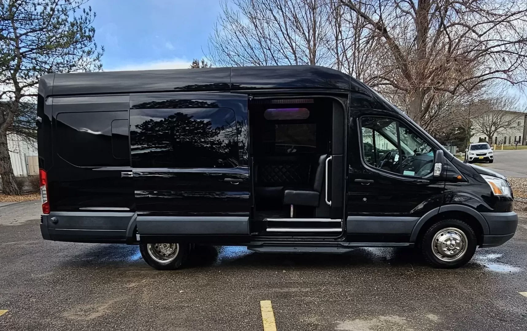 2017 Black /Black Ford Transit with an Gas engine, Auto transmission, 0.000000, 0.000000 - 2017 FORD TRANSIT 3.7L GAS ENGINE BUILT BY PINNICALE INTERIOR BLACK DIAMOND PATTERN LIMO BENCH SEATS 10 PASSENGERS PLUS DRIVER AND COPILOT - RACK LIMO BENCH SEATING POWER PARTITION TV'S FRONT AND REAR COVED RGB LIGHTING ON SIDE WALLS OVER HEAD DOME LIGHTS GRAY WOOD LOOK FLOORING MAYBACH CEILING LIGH - Photo#1