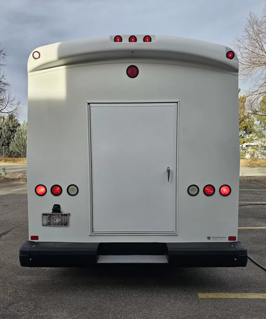 2015 White /Black Ford E450 with an V10 engine, Auto transmission, 0.000000, 0.000000 - 2015 FORD E450 CHAMPION - CHALLENGER V-10 GAS 24 PASSENGER PLUS DRIVER WHITE EXTERIOR EXECUTIVE SHUTTLE BLACK EXECUTIVE SEATS AISLE ARMREST LAP BELTS RECLINER SEATS WOOD LOOK FLOORING REAR LUGGAGE AND MUCH MORE! - WELL MAINTAINED FINANCING AVAILABLE LOCATED IN FT COLLINS - Photo#14