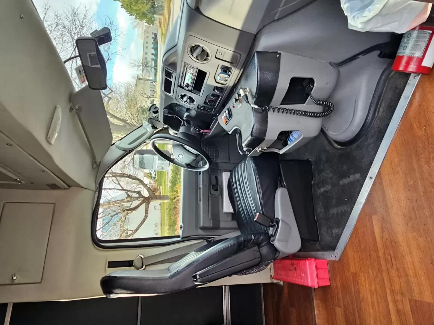 2015 White /Black Ford E450 with an V10 engine, Auto transmission, 0.000000, 0.000000 - 2015 FORD E450 CHAMPION - CHALLENGER V-10 GAS 24 PASSENGER PLUS DRIVER WHITE EXTERIOR EXECUTIVE SHUTTLE BLACK EXECUTIVE SEATS AISLE ARMREST LAP BELTS RECLINER SEATS WOOD LOOK FLOORING REAR LUGGAGE AND MUCH MORE! - WELL MAINTAINED FINANCING AVAILABLE LOCATED IN FT COLLINS - Photo#4