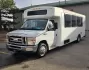 2015 White /Black Ford E450 with an V10 engine, Auto transmission, 0.000000, 0.000000 - 2015 FORD E450 CHAMPION - CHALLENGER V-10 GAS 24 PASSENGER PLUS DRIVER WHITE EXTERIOR EXECUTIVE SHUTTLE BLACK EXECUTIVE SEATS AISLE ARMREST LAP BELTS RECLINER SEATS WOOD LOOK FLOORING REAR LUGGAGE AND MUCH MORE! - WELL MAINTAINED FINANCING AVAILABLE LOCATED IN FT COLLINS - Photo#0