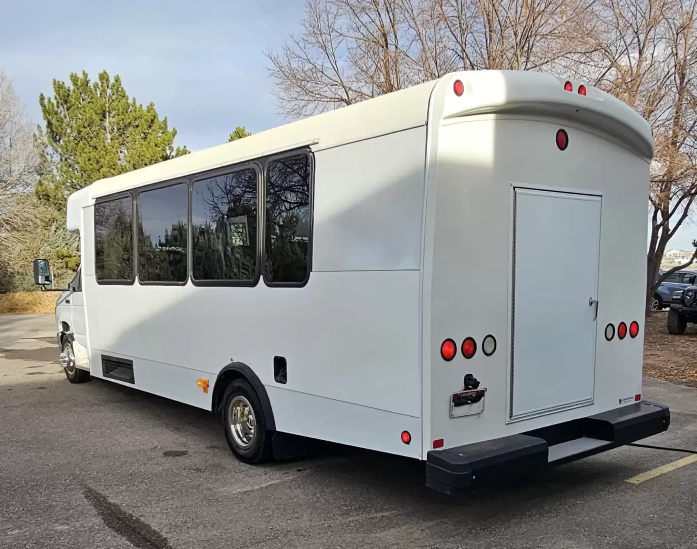 2015 White /Black Ford E450 with an V10 engine, Auto transmission, 0.000000, 0.000000 - 2015 FORD E450 CHAMPION - CHALLENGER V-10 GAS 24 PASSENGER PLUS DRIVER WHITE EXTERIOR EXECUTIVE SHUTTLE BLACK EXECUTIVE SEATS AISLE ARMREST LAP BELTS RECLINER SEATS WOOD LOOK FLOORING REAR LUGGAGE AND MUCH MORE! - WELL MAINTAINED FINANCING AVAILABLE LOCATED IN FT COLLINS - Photo#3