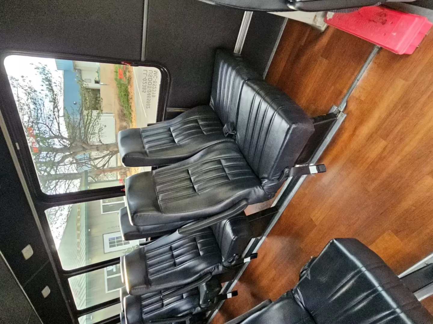 2015 White /Black Ford E450 with an V10 engine, Auto transmission, 0.000000, 0.000000 - 2015 FORD E450 CHAMPION - CHALLENGER V-10 GAS 24 PASSENGER PLUS DRIVER WHITE EXTERIOR EXECUTIVE SHUTTLE BLACK EXECUTIVE SEATS AISLE ARMREST LAP BELTS RECLINER SEATS WOOD LOOK FLOORING REAR LUGGAGE AND MUCH MORE! - WELL MAINTAINED FINANCING AVAILABLE LOCATED IN FT COLLINS - Photo#8