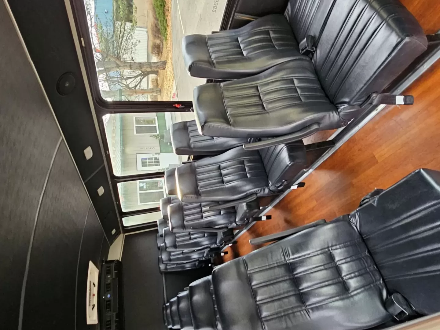 2015 White /Black Ford E450 with an V10 engine, Auto transmission, 0.000000, 0.000000 - 2015 FORD E450 CHAMPION - CHALLENGER V-10 GAS 24 PASSENGER PLUS DRIVER WHITE EXTERIOR EXECUTIVE SHUTTLE BLACK EXECUTIVE SEATS AISLE ARMREST LAP BELTS RECLINER SEATS WOOD LOOK FLOORING REAR LUGGAGE AND MUCH MORE! - WELL MAINTAINED FINANCING AVAILABLE LOCATED IN FT COLLINS - Photo#9