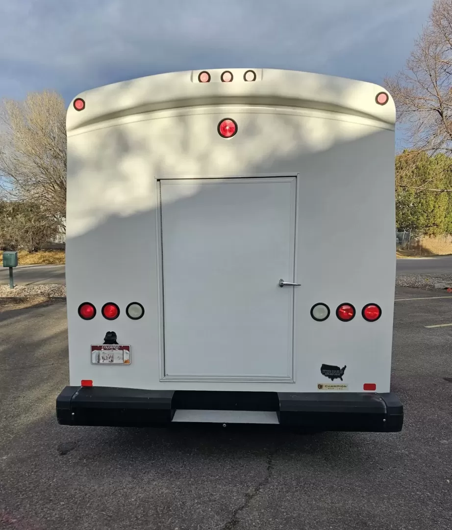 2015 White /Black Ford E450 with an V10 engine, Auto transmission, 0.000000, 0.000000 - 2015 FORD E450 CHAMPION - CHALLENGER V-10 GAS 24 PASSENGER PLUS DRIVER WHITE EXTERIOR EXECUTIVE SHUTTLE BLACK EXECUTIVE SEATS AISLE ARMREST LAP BELTS RECLINER SEATS WOOD LOOK FLOORING REAR LUGGAGE AND MUCH MORE! SIDE PANEL DRIVERS SIDE DAMAGE LOW MILES - WELL MAINTAINED FINANCING AVAILABLE LOCATED I - Photo#15