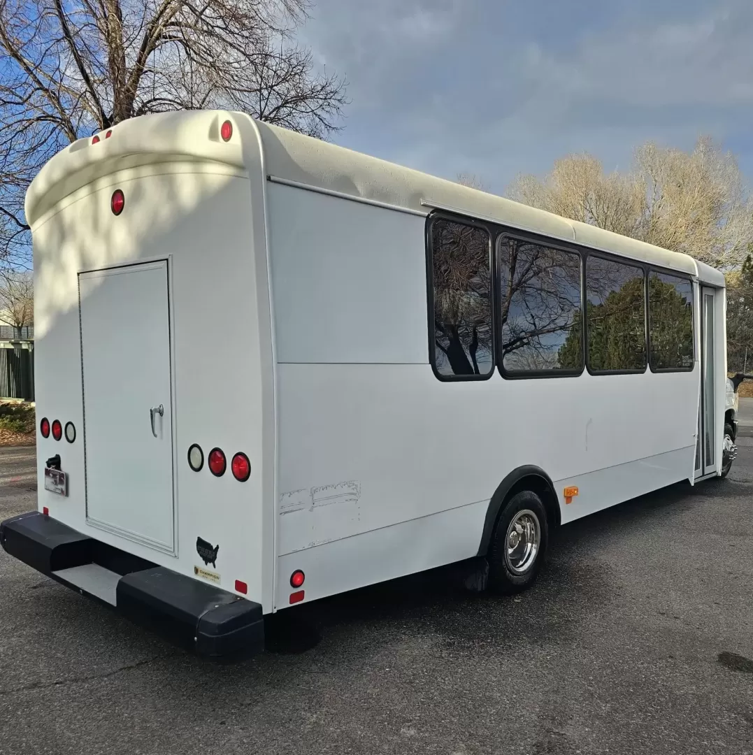 2015 White /Black Ford E450 with an V10 engine, Auto transmission, 0.000000, 0.000000 - 2015 FORD E450 CHAMPION - CHALLENGER V-10 GAS 24 PASSENGER PLUS DRIVER WHITE EXTERIOR EXECUTIVE SHUTTLE BLACK EXECUTIVE SEATS AISLE ARMREST LAP BELTS RECLINER SEATS WOOD LOOK FLOORING REAR LUGGAGE AND MUCH MORE! SIDE PANEL DRIVERS SIDE DAMAGE LOW MILES - WELL MAINTAINED FINANCING AVAILABLE LOCATED I - Photo#12