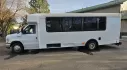 2015 White /Black Ford E450 with an V10 engine, Auto transmission, 0.000000, 0.000000 - 2015 FORD E450 CHAMPION - CHALLENGER V-10 GAS 24 PASSENGER PLUS DRIVER WHITE EXTERIOR EXECUTIVE SHUTTLE BLACK EXECUTIVE SEATS AISLE ARMREST LAP BELTS RECLINER SEATS WOOD LOOK FLOORING REAR LUGGAGE AND MUCH MORE! SIDE PANEL DRIVERS SIDE DAMAGE LOW MILES - WELL MAINTAINED FINANCING AVAILABLE LOCATED I - Photo#1