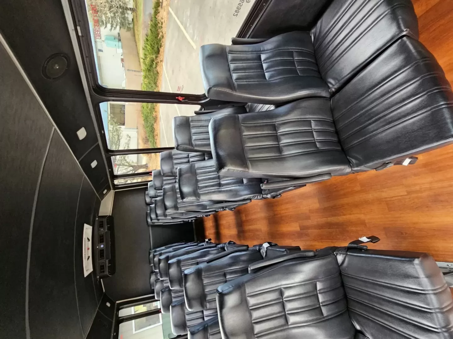 2015 White /Black Ford E450 with an V10 engine, Auto transmission, 0.000000, 0.000000 - 2015 FORD E450 CHAMPION - CHALLENGER V-10 GAS 24 PASSENGER PLUS DRIVER WHITE EXTERIOR EXECUTIVE SHUTTLE BLACK EXECUTIVE SEATS AISLE ARMREST LAP BELTS RECLINER SEATS WOOD LOOK FLOORING REAR LUGGAGE AND MUCH MORE! SIDE PANEL DRIVERS SIDE DAMAGE LOW MILES - WELL MAINTAINED FINANCING AVAILABLE LOCATED I - Photo#2