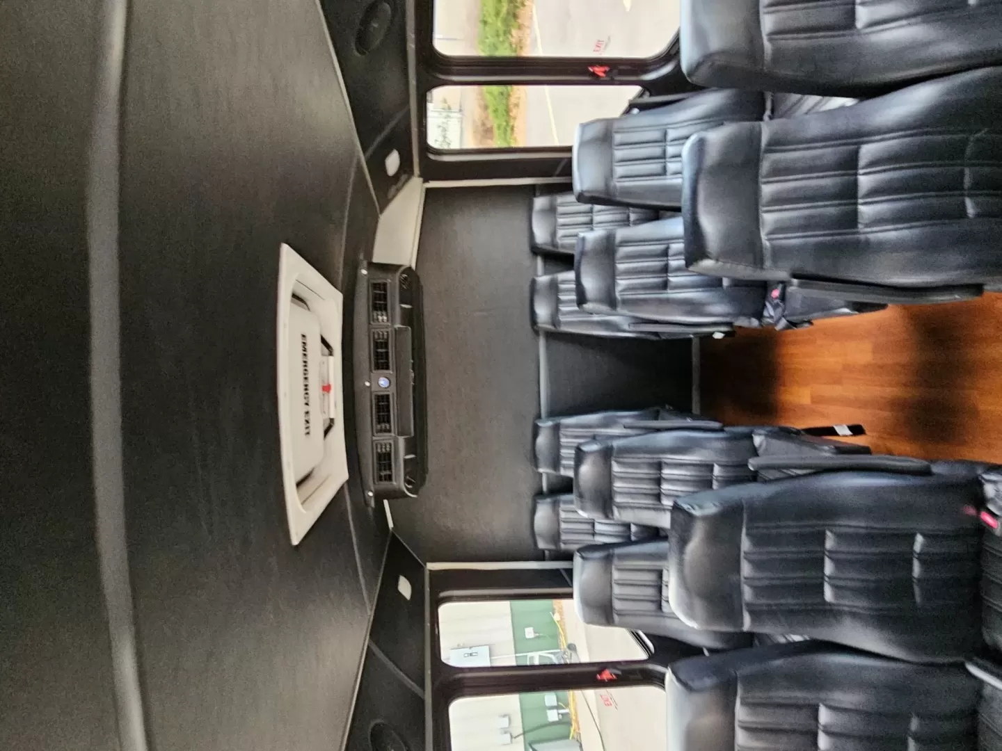 2015 White /Black Ford E450 with an V10 engine, Auto transmission, 0.000000, 0.000000 - 2015 FORD E450 CHAMPION - CHALLENGER V-10 GAS 24 PASSENGER PLUS DRIVER WHITE EXTERIOR EXECUTIVE SHUTTLE BLACK EXECUTIVE SEATS AISLE ARMREST LAP BELTS RECLINER SEATS WOOD LOOK FLOORING REAR LUGGAGE AND MUCH MORE! SIDE PANEL DRIVERS SIDE DAMAGE LOW MILES - WELL MAINTAINED FINANCING AVAILABLE LOCATED I - Photo#4