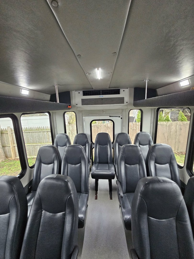 2019 White /Black Ford E450 with an V10 engine, Auto transmission, 0.000000, 0.000000 - 2019 FORD E450 STARCRAFT WHITE EXTERIOR 6.8L V10 GAS ENGINE 25 PASSENGERS GRAY RUBBER FLOORING TRANS AIR REAR A/C SYSTEM FLOOR HEATER NEW BLACK HIGH BACK SEATS, W/ RECLINE, RETRACTABLE LAP BELTS, SEAT SIDE SLIDERS AND ARMRESTS REAR LUGGAGE (DOOR) NO LUGGAGE SPACE CENTER MOUNT FLIP DOWN TV'S (2) BACK - Photo#13