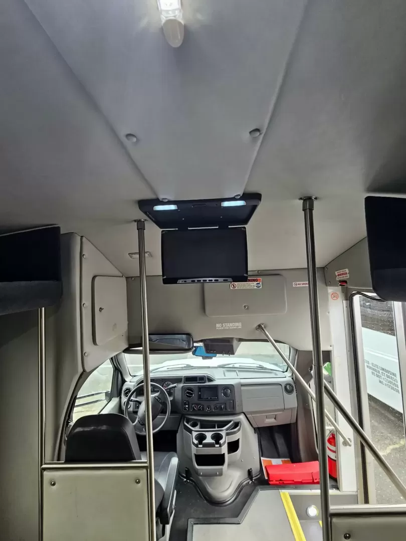 2019 White /Black Ford E450 with an V10 engine, Auto transmission, 0.000000, 0.000000 - 2019 FORD E450 STARCRAFT WHITE EXTERIOR 6.8L V10 GAS ENGINE 25 PASSENGERS GRAY RUBBER FLOORING TRANS AIR REAR A/C SYSTEM FLOOR HEATER NEW BLACK HIGH BACK SEATS, W/ RECLINE, RETRACTABLE LAP BELTS, SEAT SIDE SLIDERS AND ARMRESTS REAR LUGGAGE (DOOR) NO LUGGAGE SPACE CENTER MOUNT FLIP DOWN TV'S (2) BACK - Photo#17