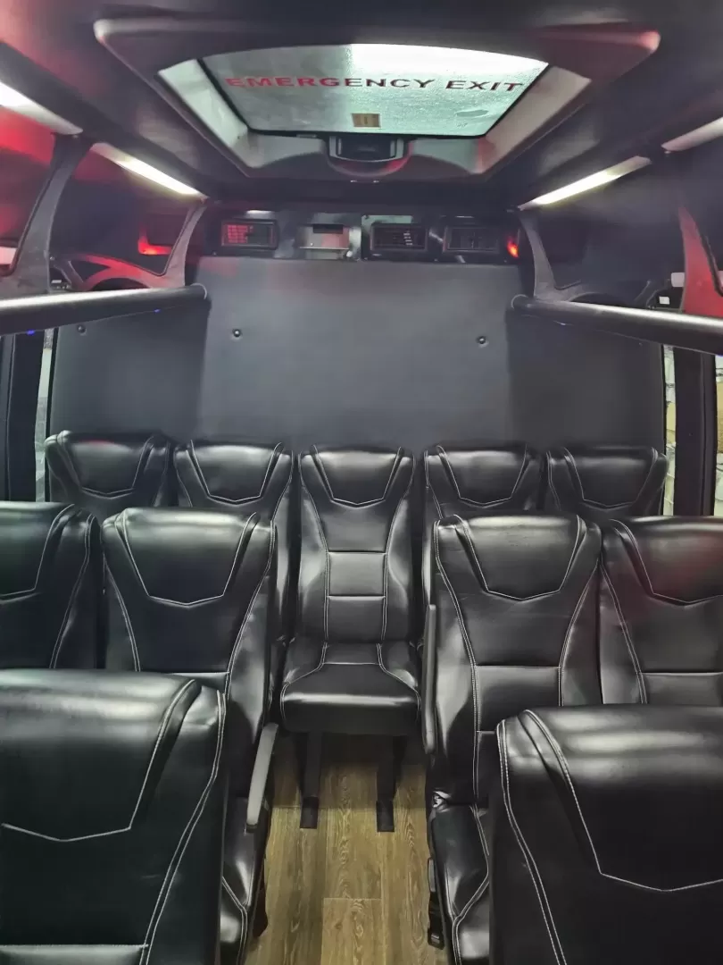 2017 Black /Black Ford E450 with an V10 engine, Automatic transmission, 0.000000, 0.000000 - 2017 FORD E450 FEDERAL COACH (EXECUTIVE STYLE) 6.8L V10 GAS ENGINE MILES -24 PASSENGERS WOOD LOOK FLOORING REAR HEAT AND A/C CEILING WITH WHITE LIGHTS WHITE ACCENT LIGHTING HIGH BACK RECLINERS RETRACTABLE SEAT BELTS AISLE ARMRESTS REAR LUGGAGE WALL AND DOOR REAR BUMPER STEP CLEARVIEW ESCAPE HATCH RE- Photo#7